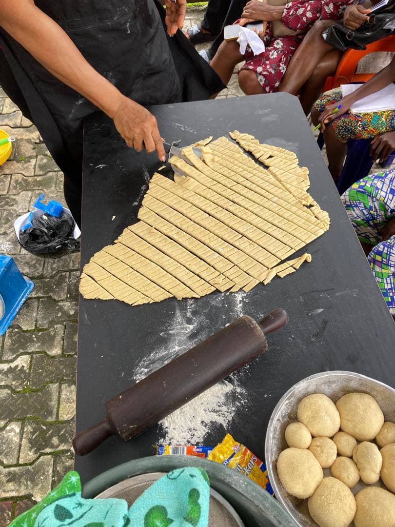Freshly prepared dough being cut during baking practice